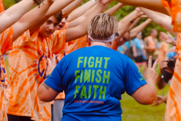 meredith pritchard back of a woman running in a 5k